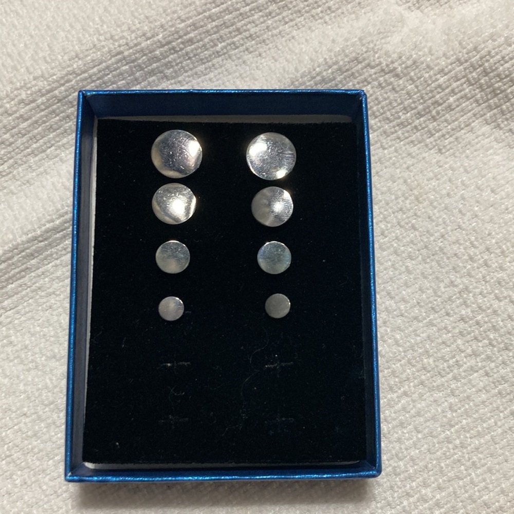 Black metal disc pierced earrings. Set of 4.